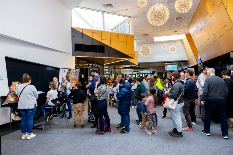 Participants waiting for their 60 second portrait at the WLF 2024 launch event